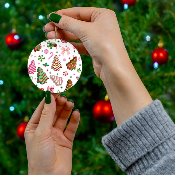 Personalized ceramic ornament featuring festive Christmas Tree Cakes, bows, and peppermint designs. Perfect for adding charm to your holiday decor.