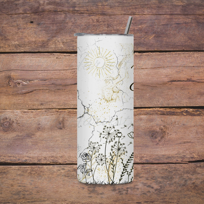 Video preview of a 20oz skinny tumbler wrap featuring a white background with a minimalist floral design in black and gold. The wrap showcases hand-drawn flowers, dandelions, a radiant sun, a glowing heart, and cracked textures, adding a unique and delicate charm to the tumbler.